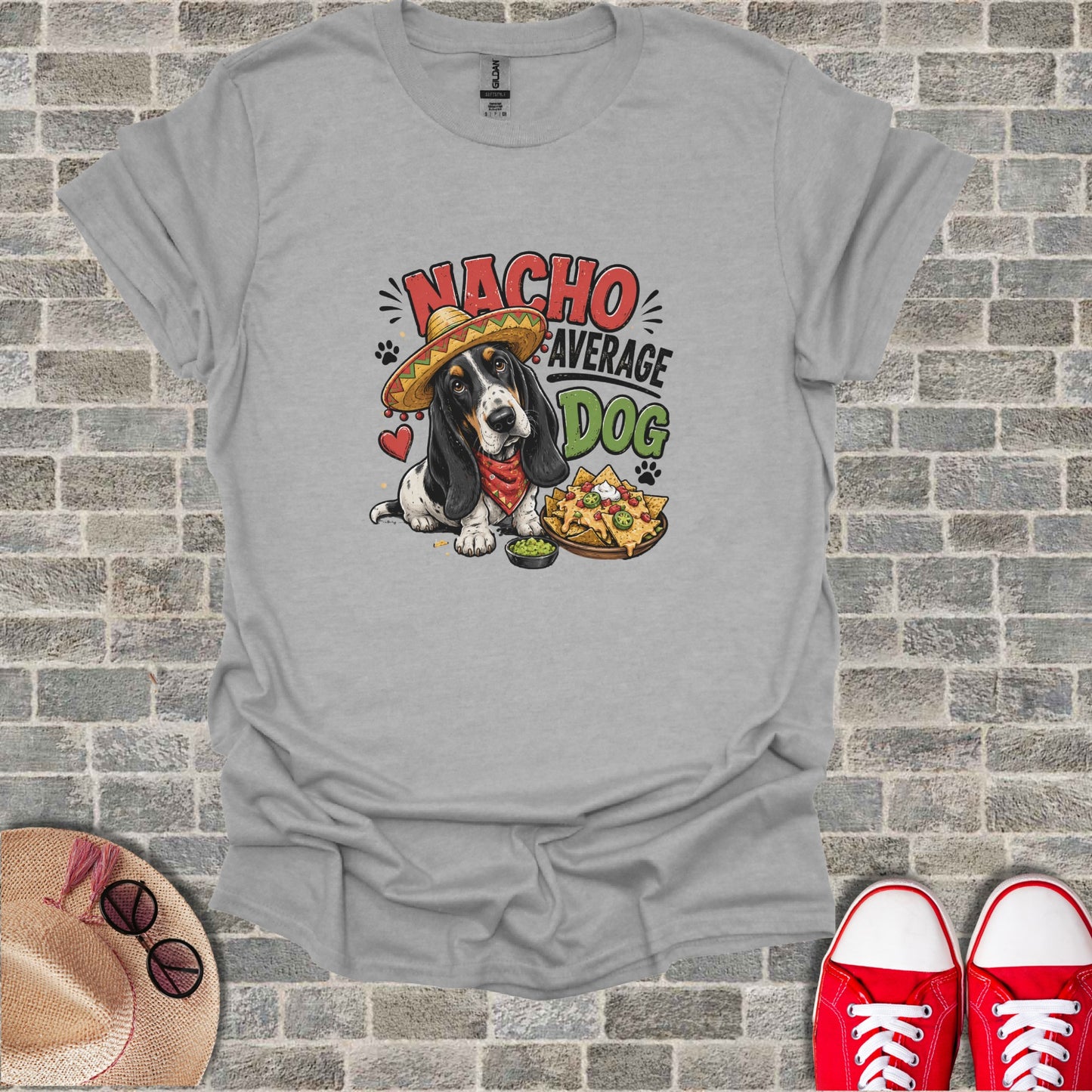 Grey t-shirt with a cartoon Basset Hound wearing a sombrero and eating nachos.