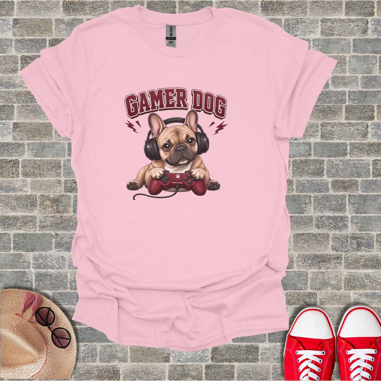 French bulldog wearing headphones and holding a video game controller.