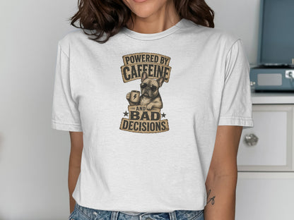 White t-shirt with graphic of dog holding coffee cup, "Powered by Caffeine and Bad Decisions".