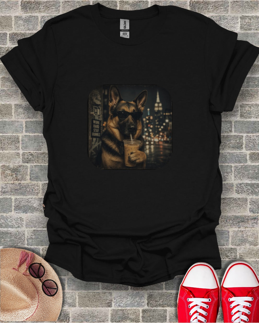 Black t-shirt with graphic of German Shepherd in sunglasses drinking an iced coffee.