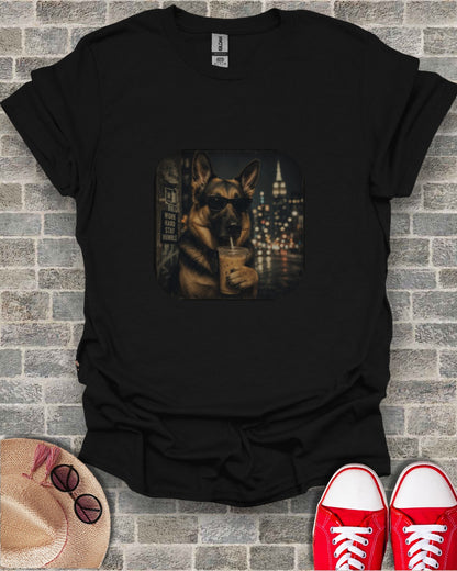 Black t-shirt with graphic of German Shepherd in sunglasses drinking an iced coffee.