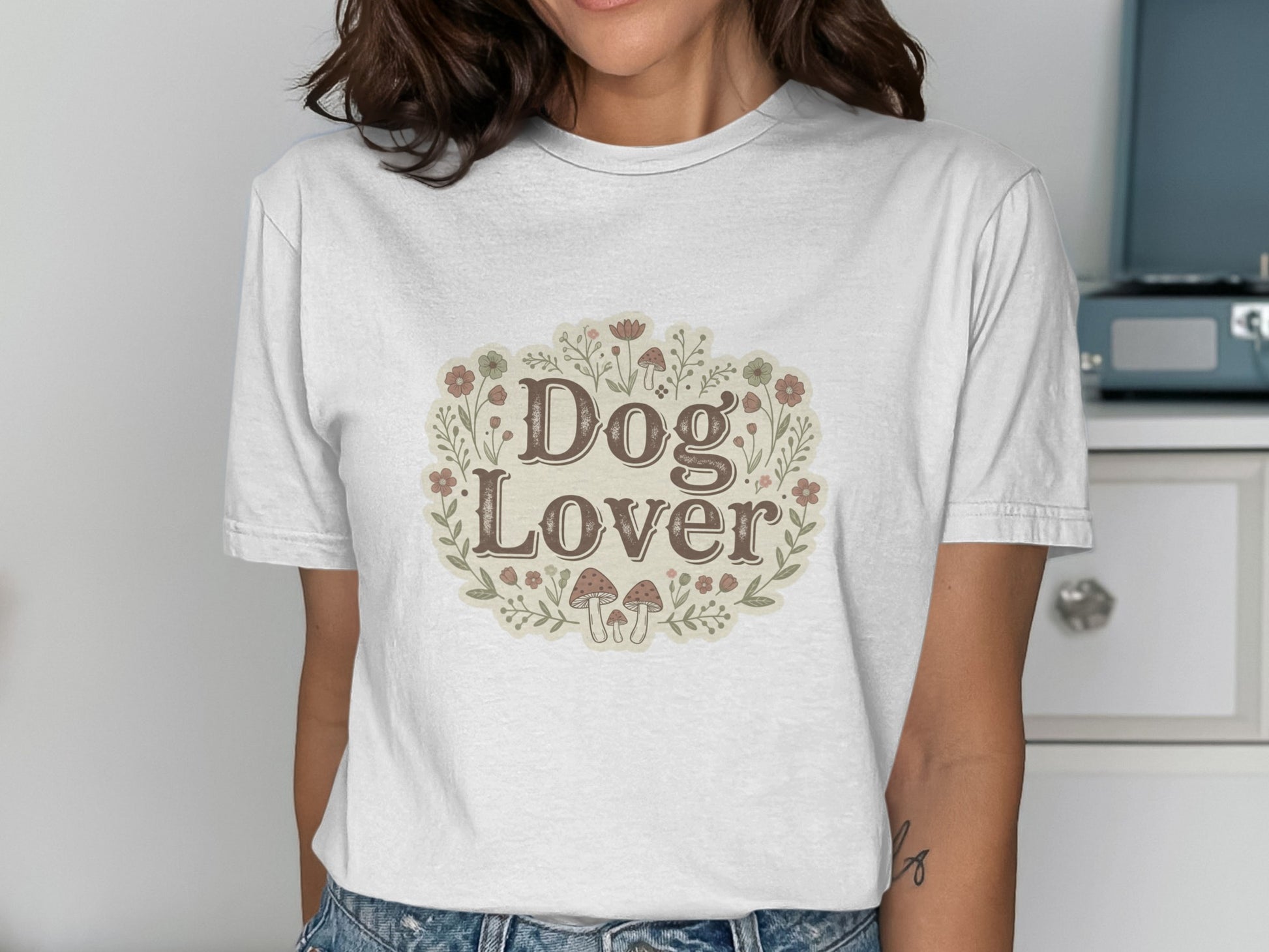 White t-shirt with "Dog Lover" text and floral mushroom border design.