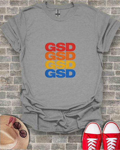 Gray t-shirt with "GSD" stacked four times in red, orange, yellow, and blue.