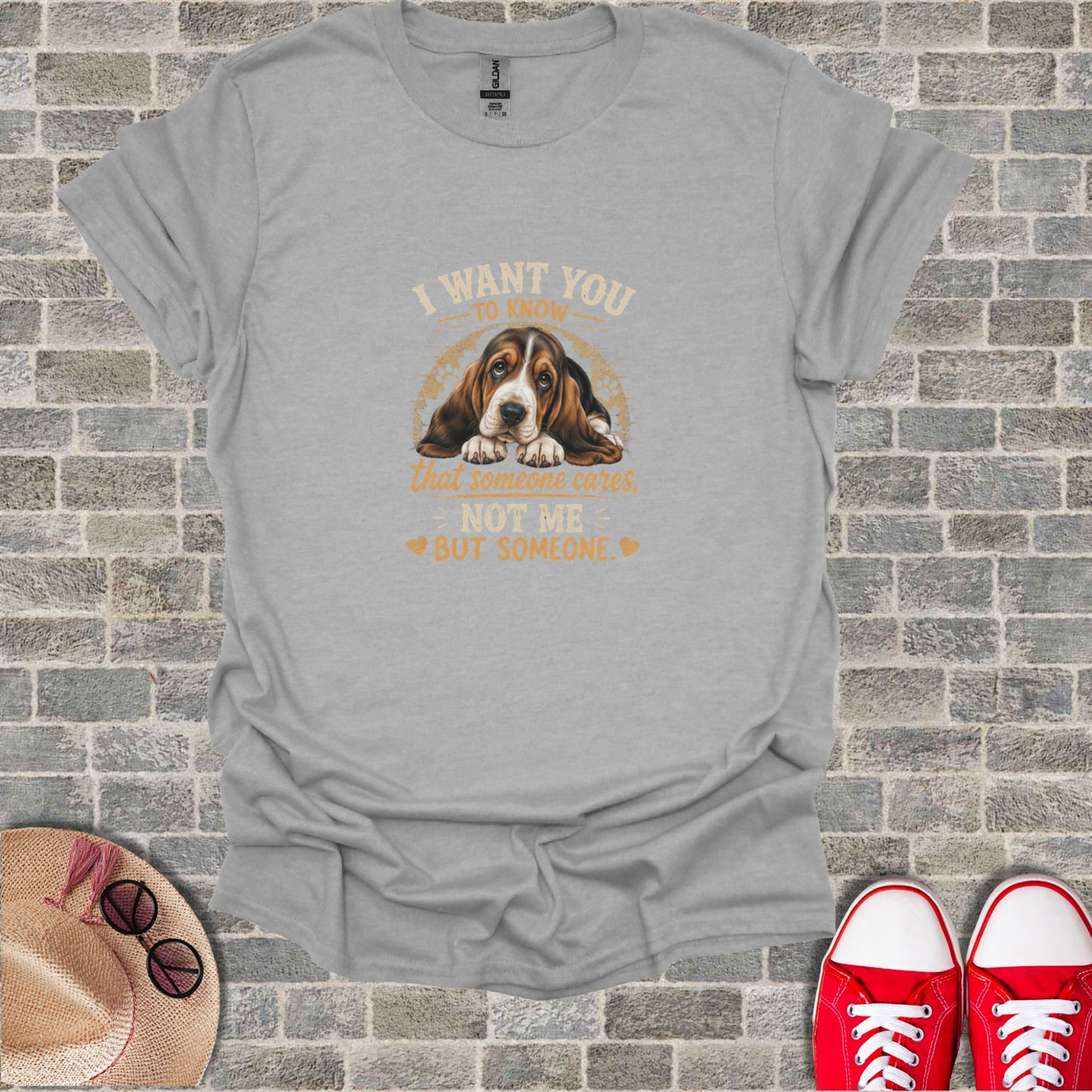 Gray t-shirt with Basset Hound and text "I want you to know that someone cares, not me but someone."