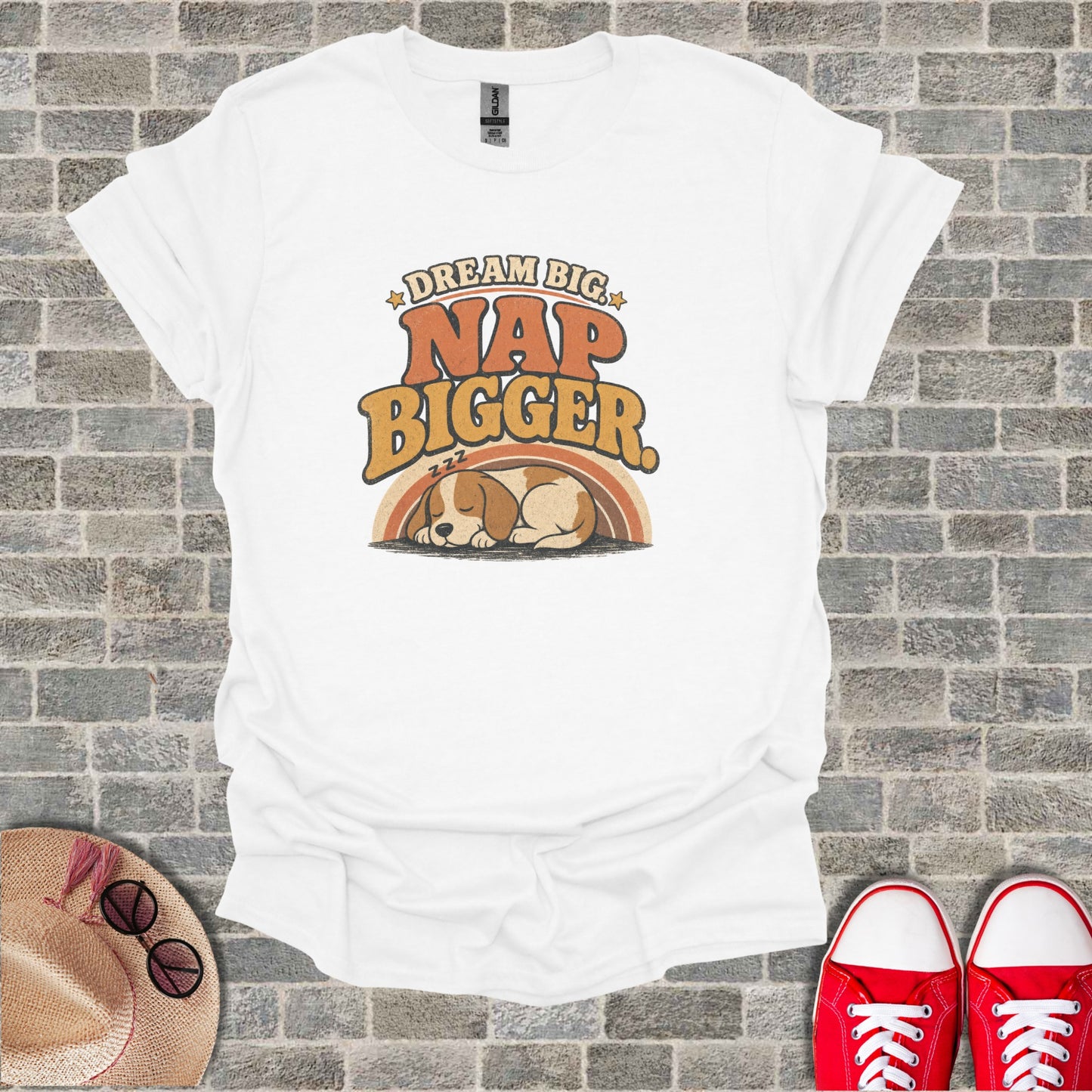 White t-shirt with "Dream Big Nap Bigger" text and sleeping puppy graphic.