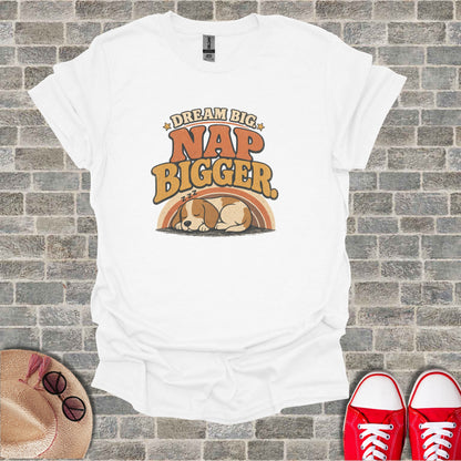 White t-shirt with "Dream Big Nap Bigger" text and sleeping puppy graphic.