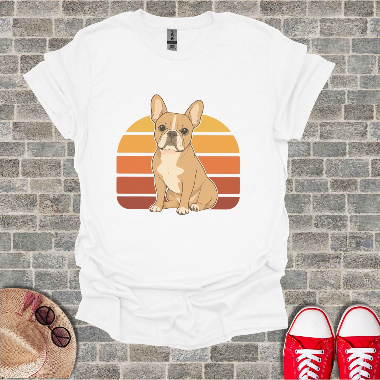 White t-shirt with a graphic of a French bulldog in front of a retro sunset.