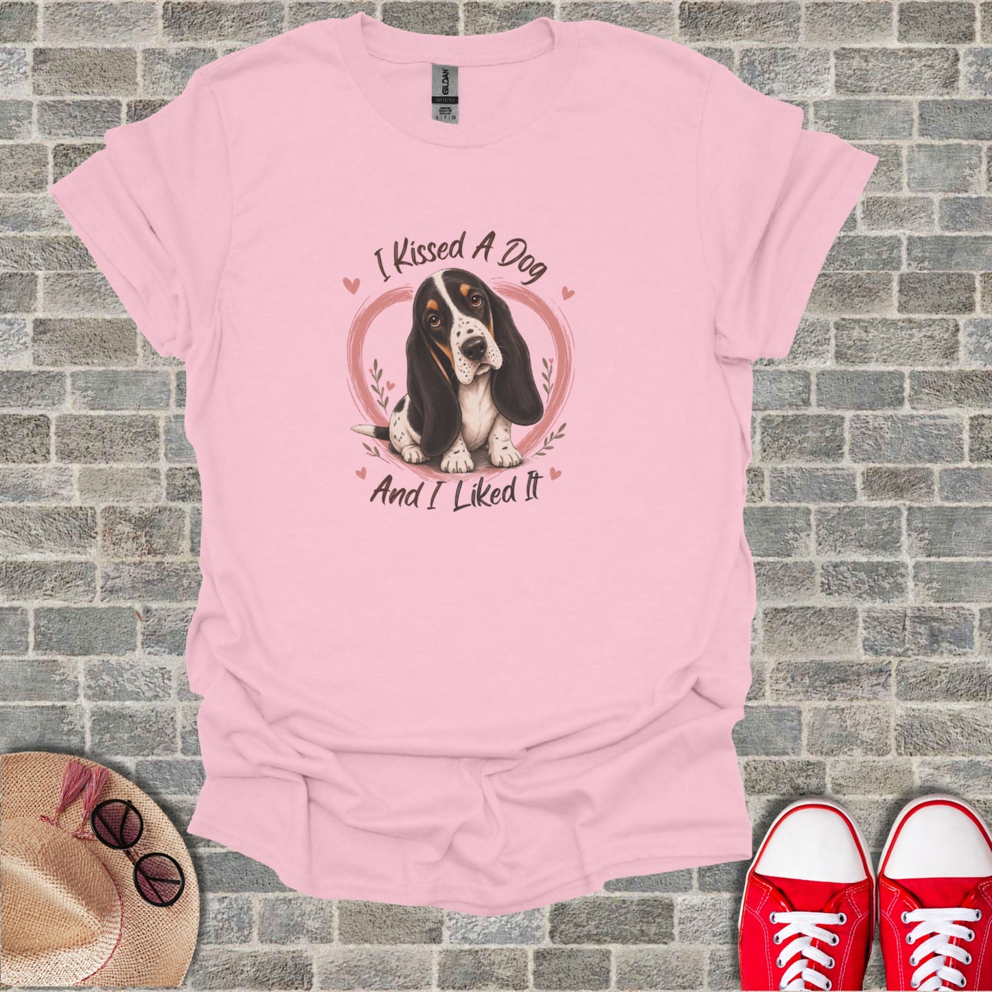 Pink t-shirt with Basset Hound and text "I Kissed A Dog And I Liked It".