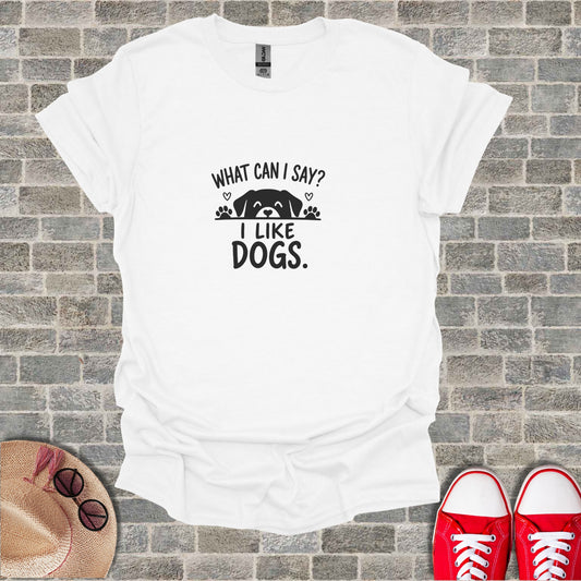 White t-shirt with black text "WHAT CAN I SAY? I LIKE DOGS."