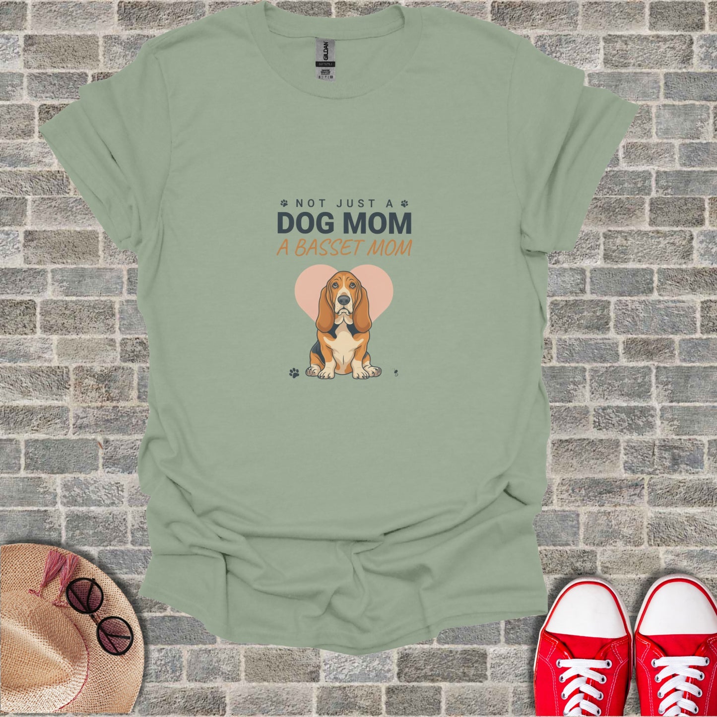 Light green t-shirt with "Not Just a Dog Mom, A Basset Mom" and Basset Hound art.