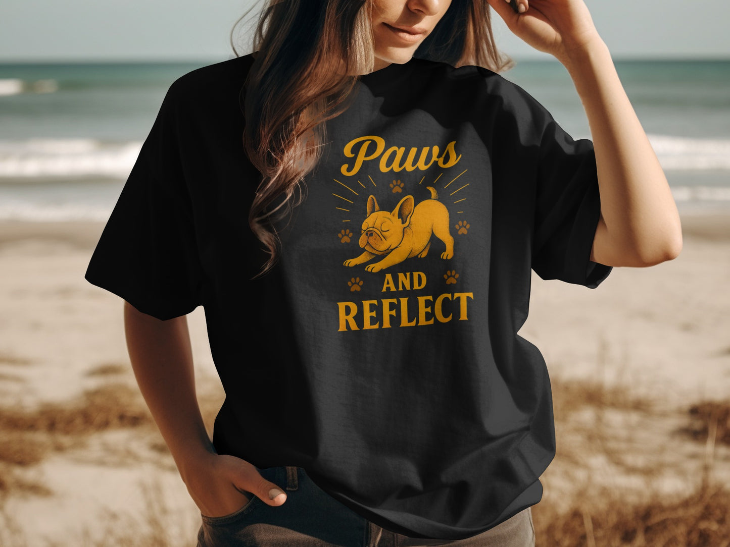 Black t-shirt with a French bulldog and "Paws and Reflect" text.