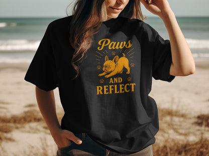 Black t-shirt with a French bulldog and "Paws and Reflect" text.
