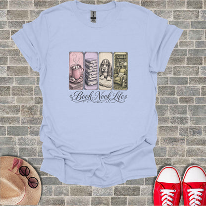 Light blue t-shirt with "Book Nook Life" and illustrations of books, a mug, and an armchair.