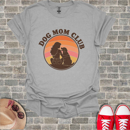 T-shirt with "Dog Mom Club" text and silhouette of a woman with a dog.