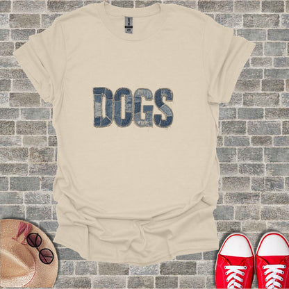 Beige t-shirt with "DOGS" in distressed denim texture, with hat and shoes.