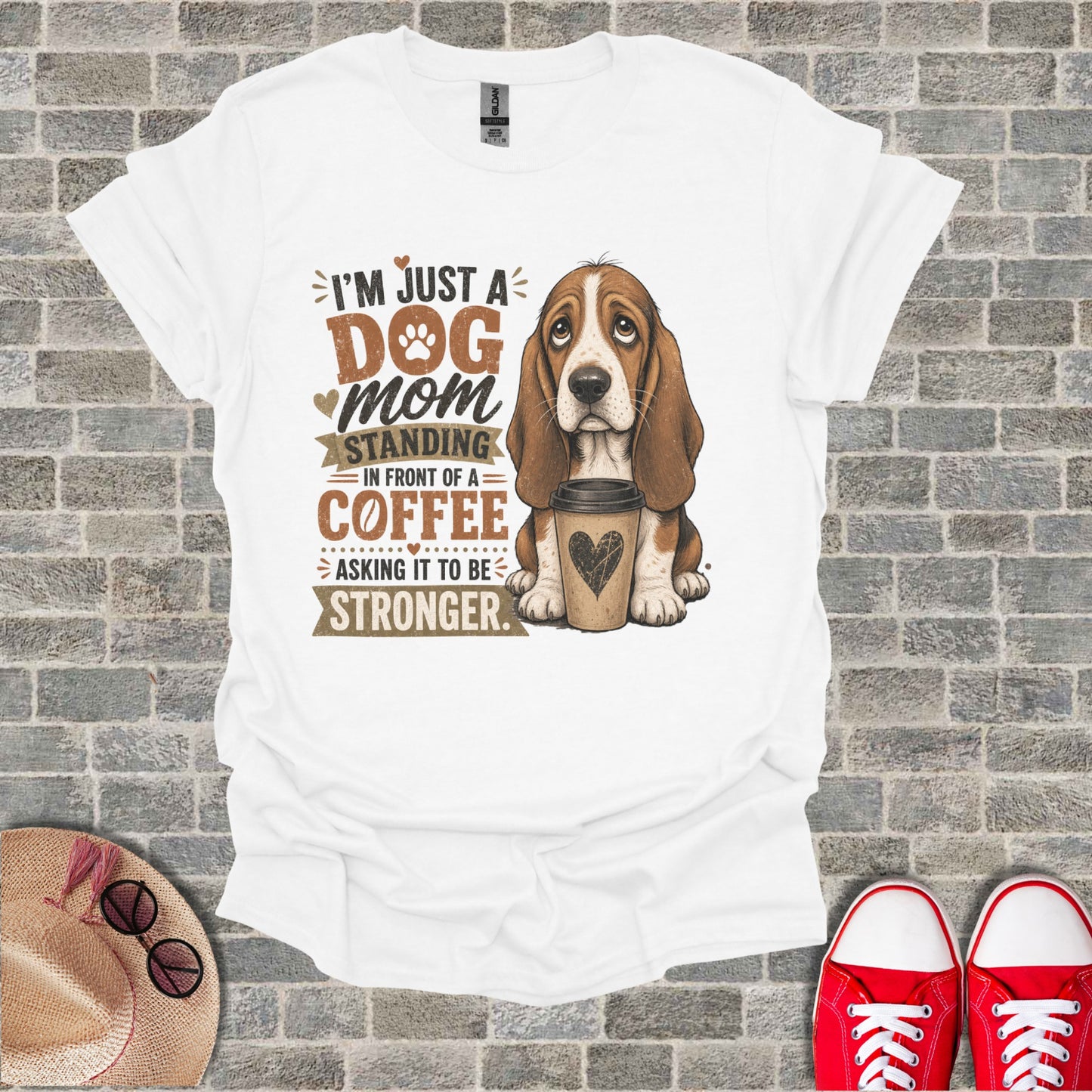 Basset hound with coffee, text says "I'm just a dog mom standing in front of a coffee asking it to be stronger."