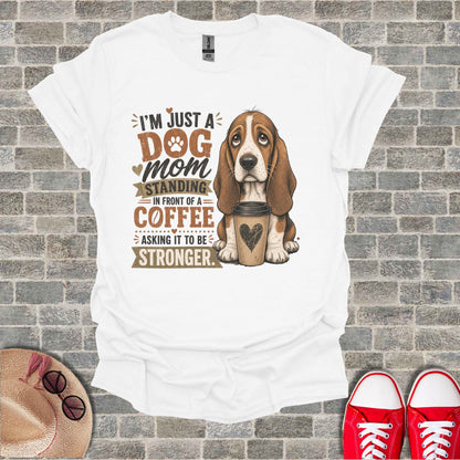 Basset hound with coffee, text says "I'm just a dog mom standing in front of a coffee asking it to be stronger."