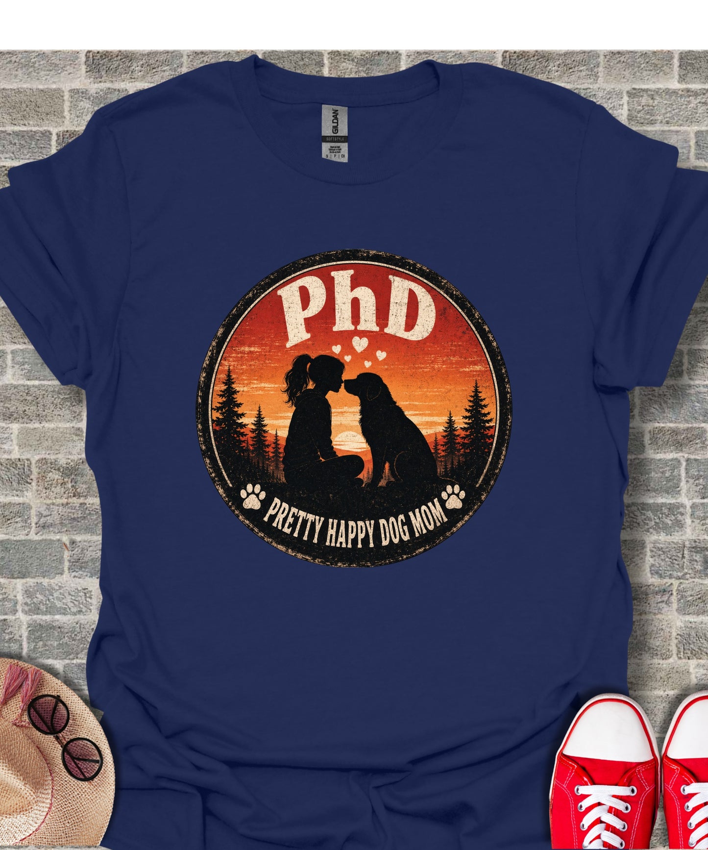 Navy t-shirt with "PhD Pretty Happy Dog Mom" text and silhouette of girl with dog.