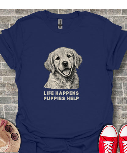 Navy t-shirt with sketch of smiling golden retriever and text "LIFE HAPPENS PUPPIES HELP."