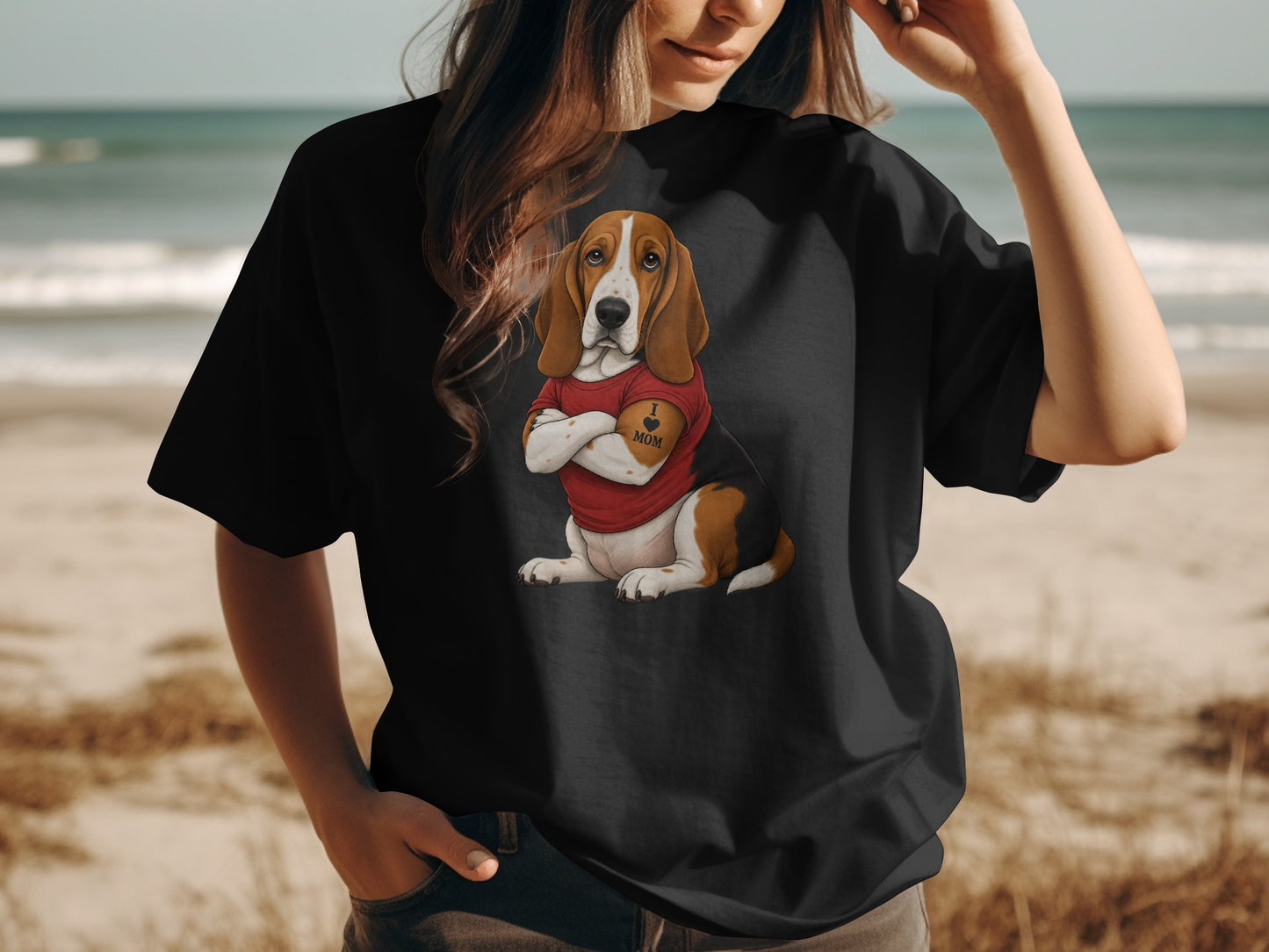 Black t-shirt on a person with a Basset Hound wearing a red shirt and "I ❤️ MOM" tattoo.