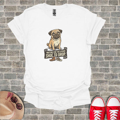 White t-shirt with pug graphic and text "WAITING FOR THE OTHER SHOE TO DROP".