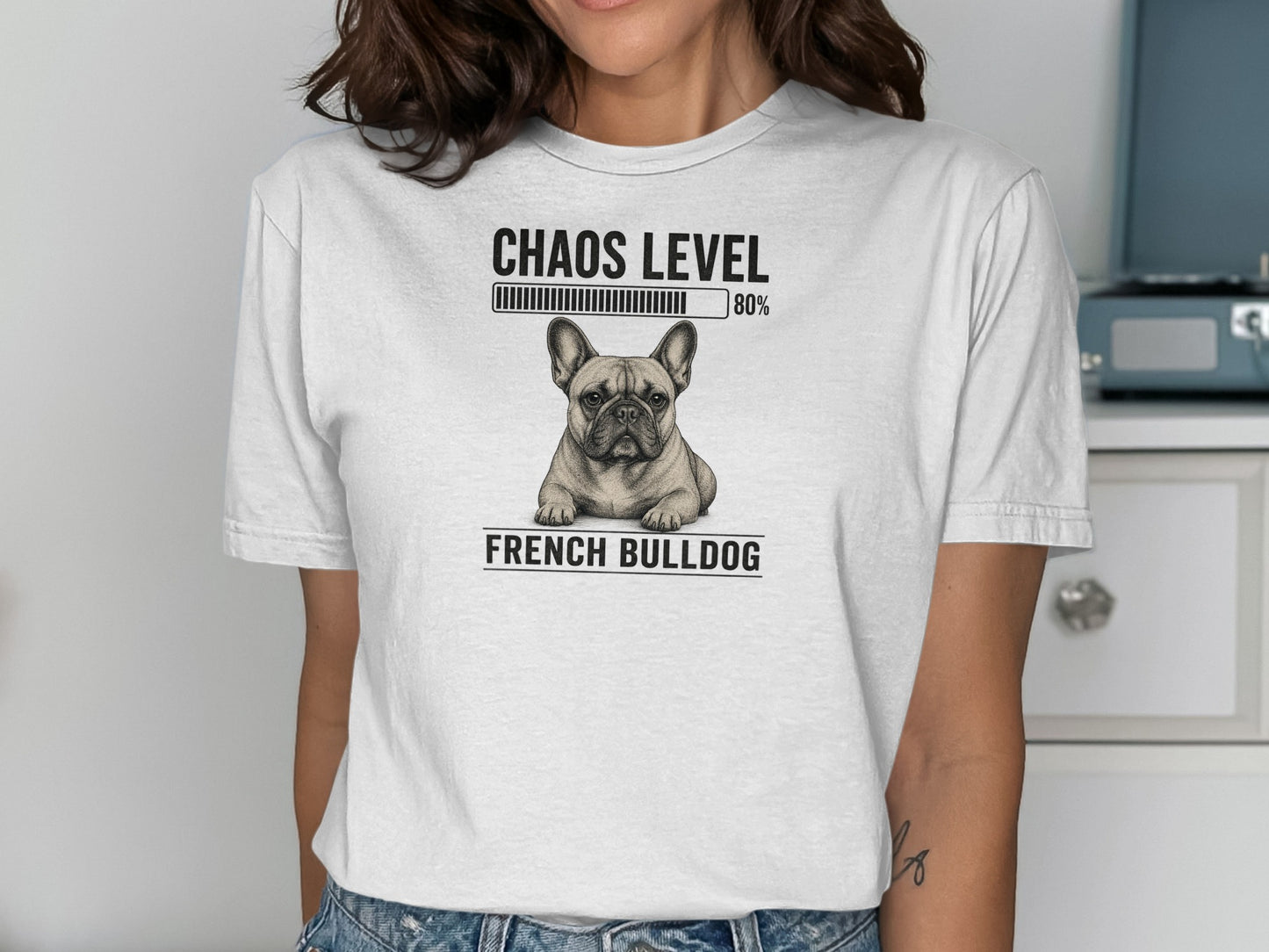 White t-shirt featuring a French Bulldog graphic and "Chaos Level 80%" text.