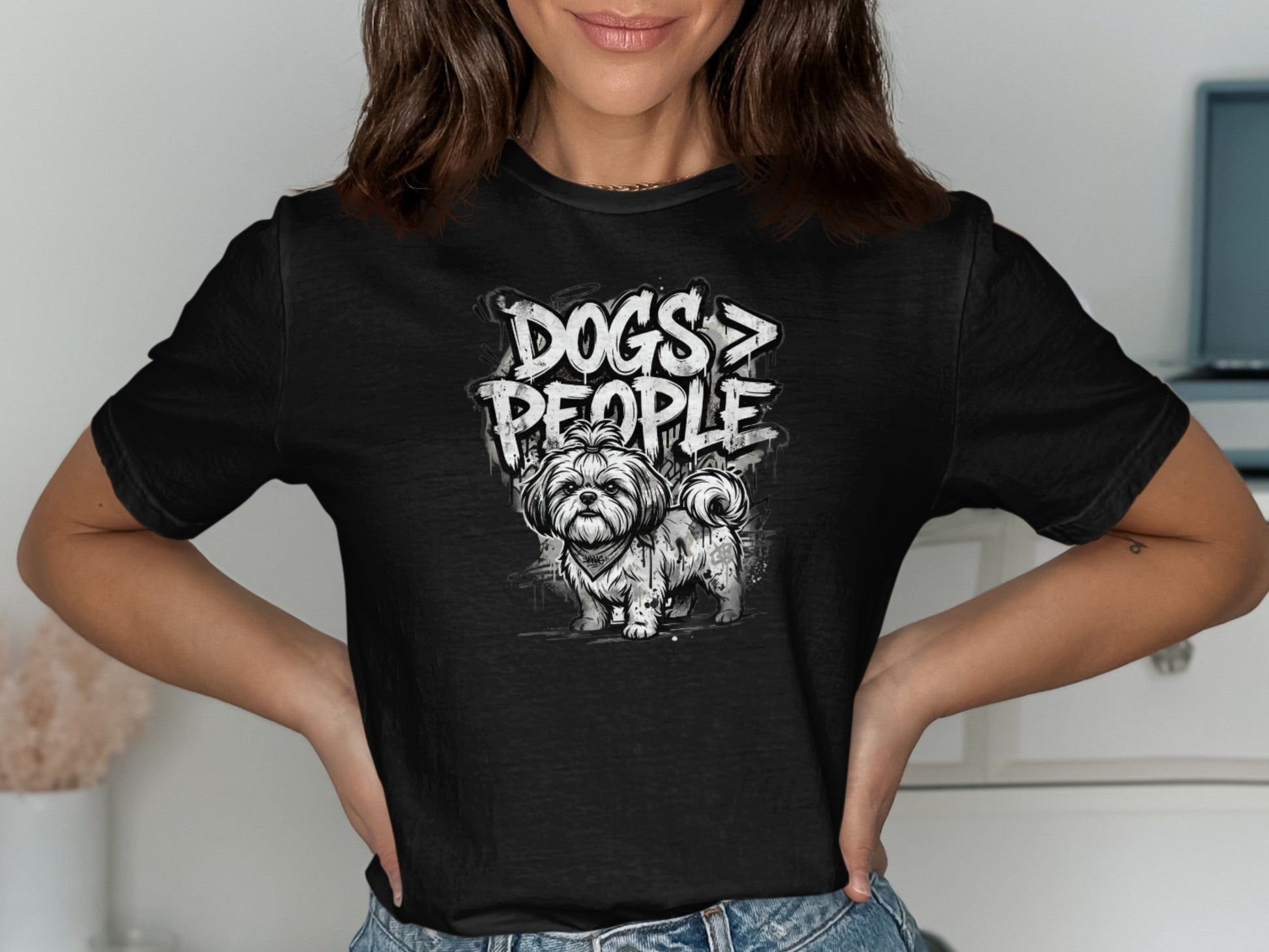 Black t-shirt with "DOGS > PEOPLE" text and a sketch of a fluffy dog.