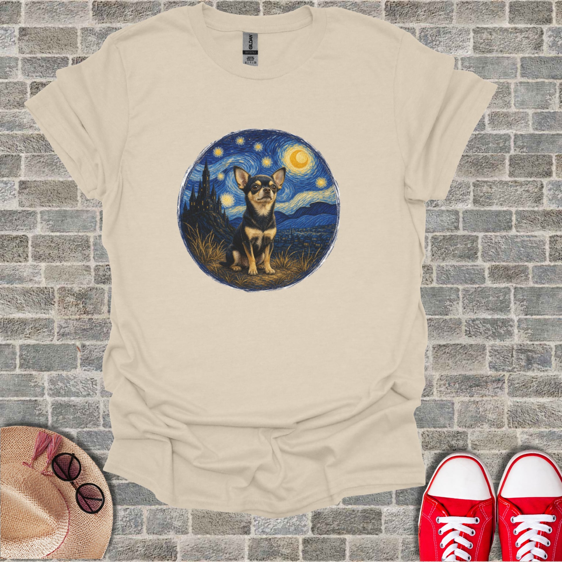 Chihuahua sitting under a starry night sky in a Van Gogh style painting on a t-shirt.
