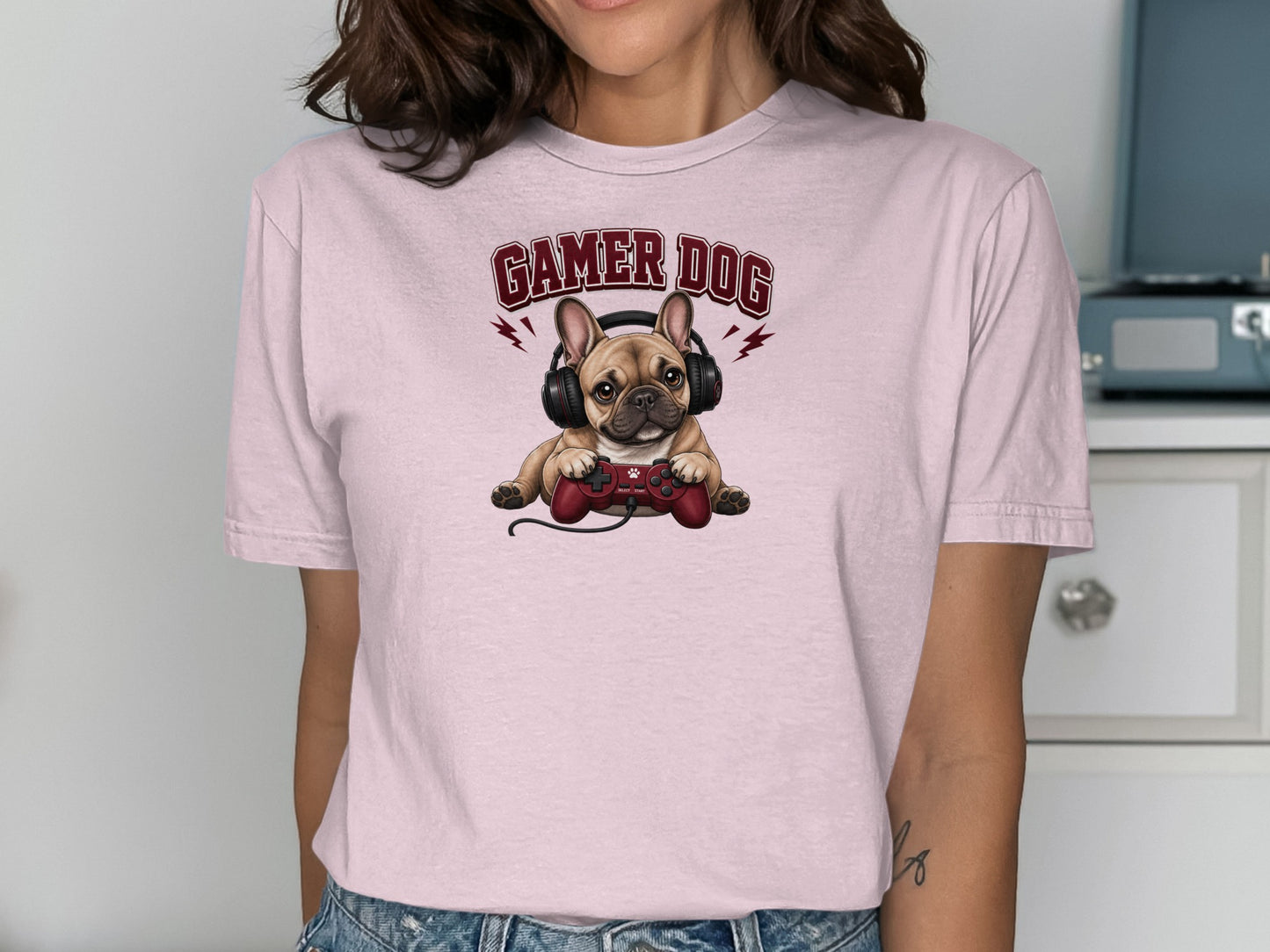 Pink t-shirt with a French bulldog wearing headphones and holding a video game controller.