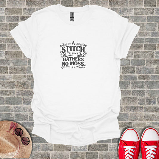 White t-shirt with "A stitch in time gathers no moss" text design.