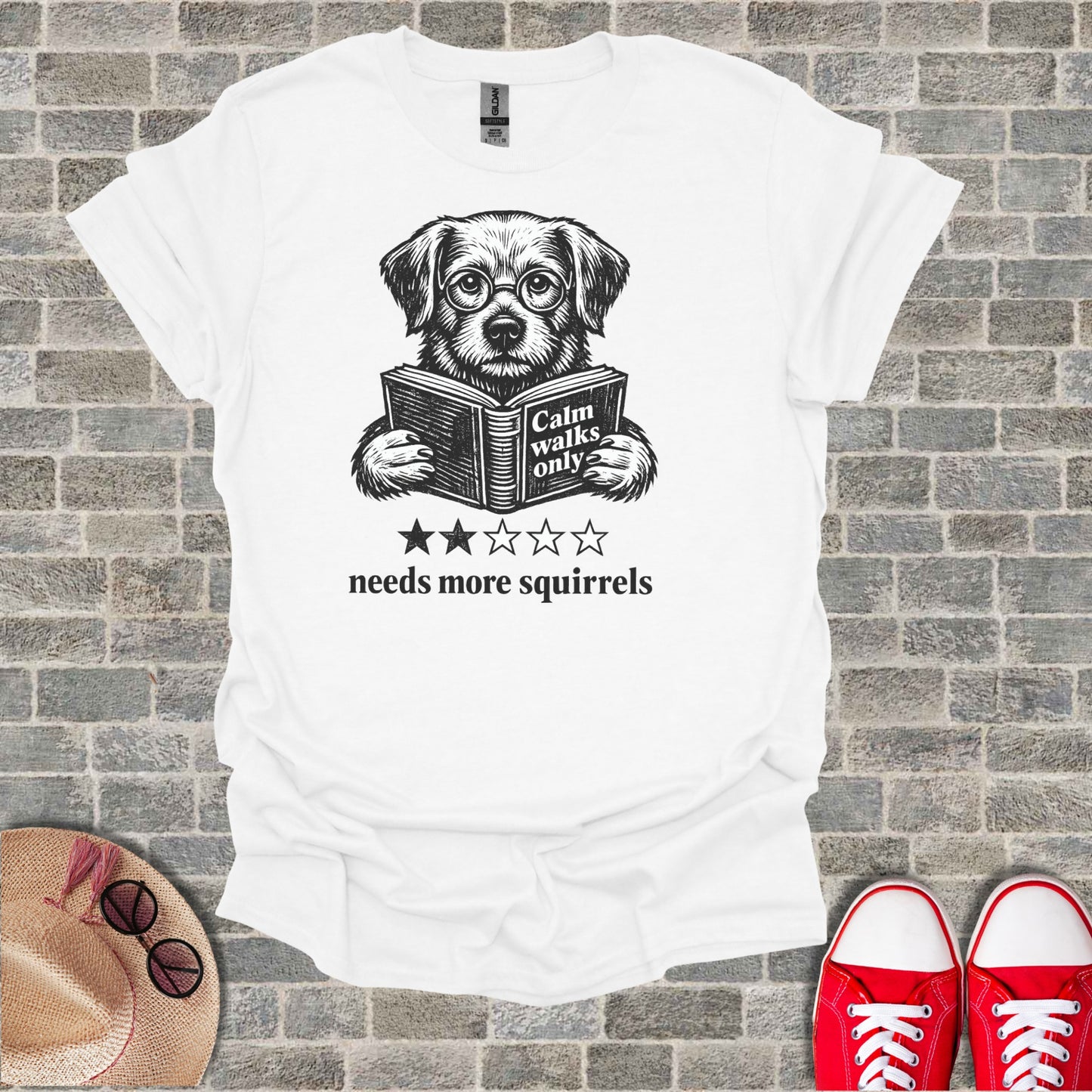 T-shirt with dog reading book, "Calm walks only, needs more squirrels".