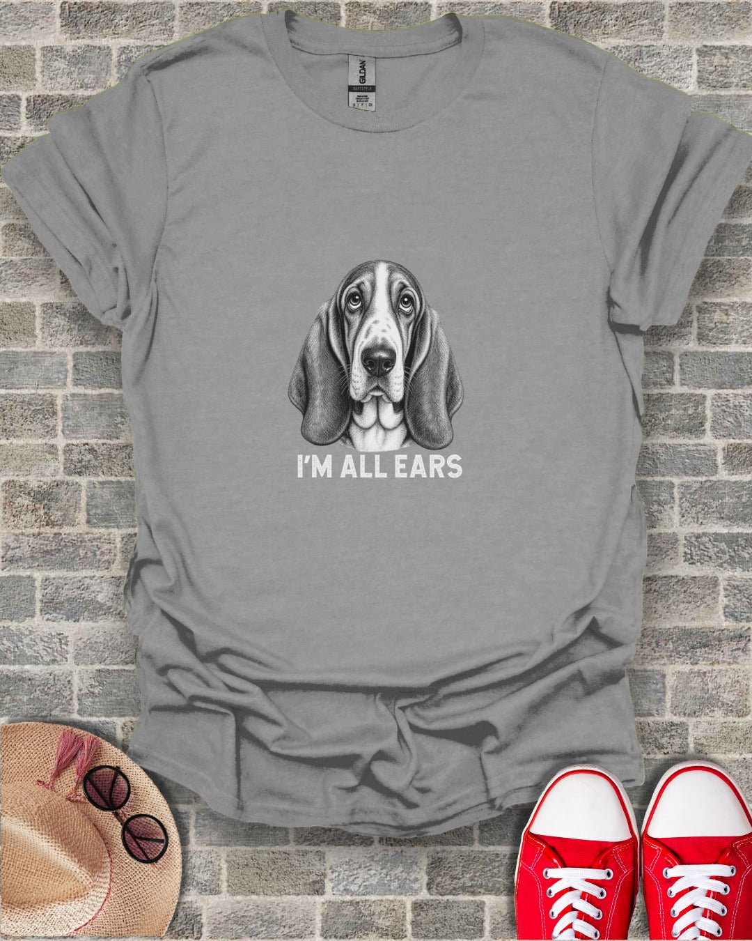 T-shirt with a drawing of a Basset Hound and text "I'M ALL EARS".