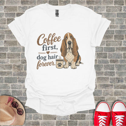 White t-shirt with Basset Hound and "Coffee first, dog hair forever." text.