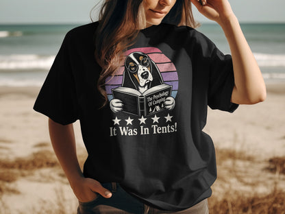 Black t-shirt with dog wearing glasses reading a book, "It Was In Tents!"