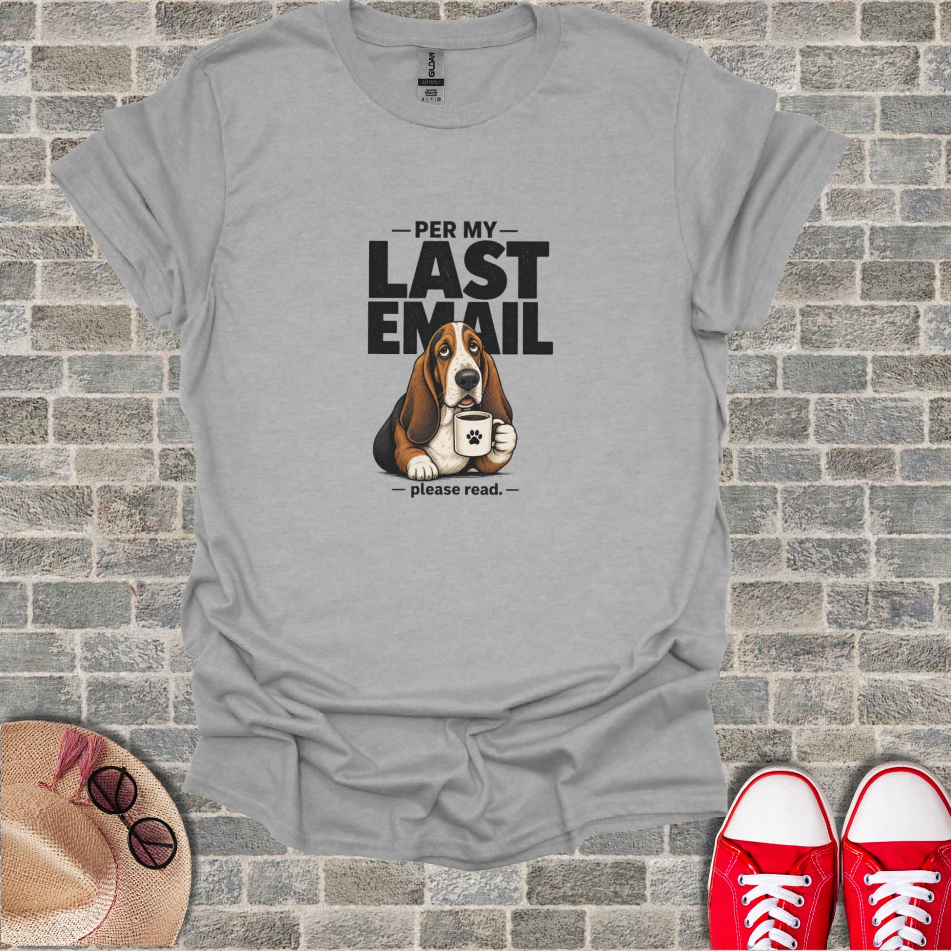 Basset hound wearing a t-shirt that says "Per my last email - please read."