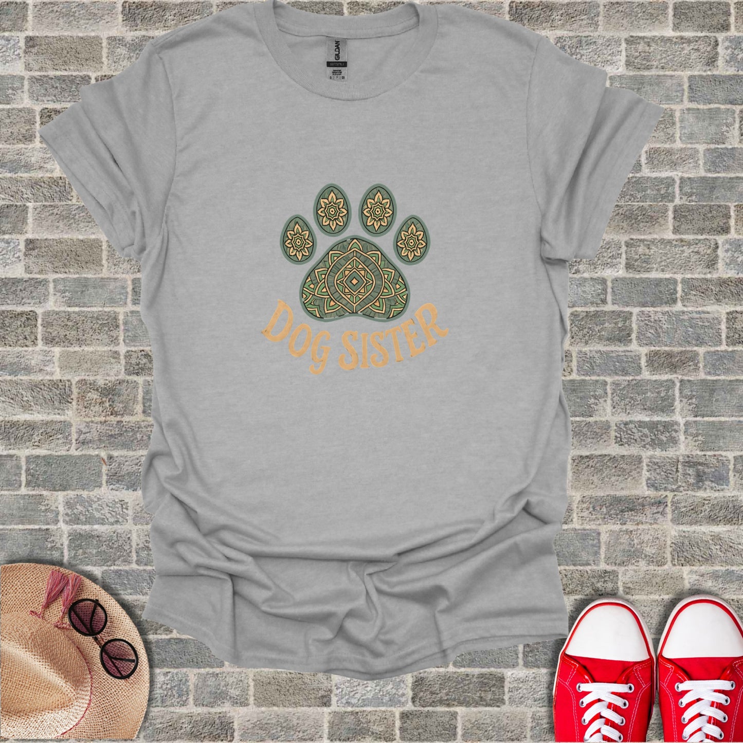 Gray t-shirt with a paw print design and "Dog Sister" text.