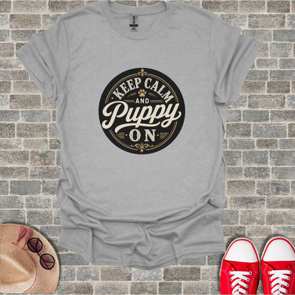 Grey t-shirt with "Keep Calm And Puppy On" text and puppy silhouette.