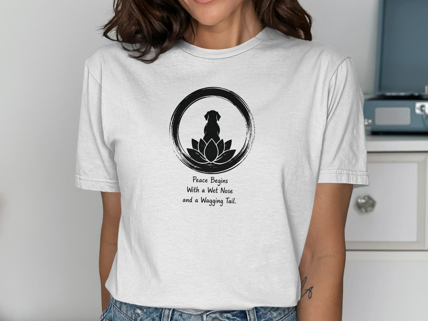 Black dog silhouette in lotus circle with text "Peace Begins With a Wet Nose and a Wagging Tail."