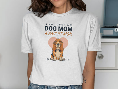White t-shirt with "Not Just a Dog Mom, A Basset Mom" text and a Basset Hound illustration.