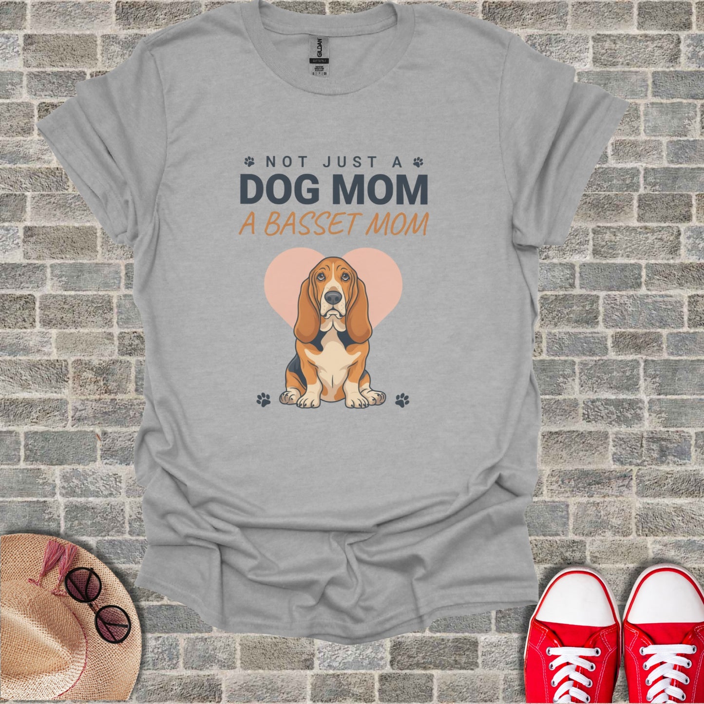 Grey t-shirt with "Not Just a Dog Mom a Basset Mom" and basset hound illustration.