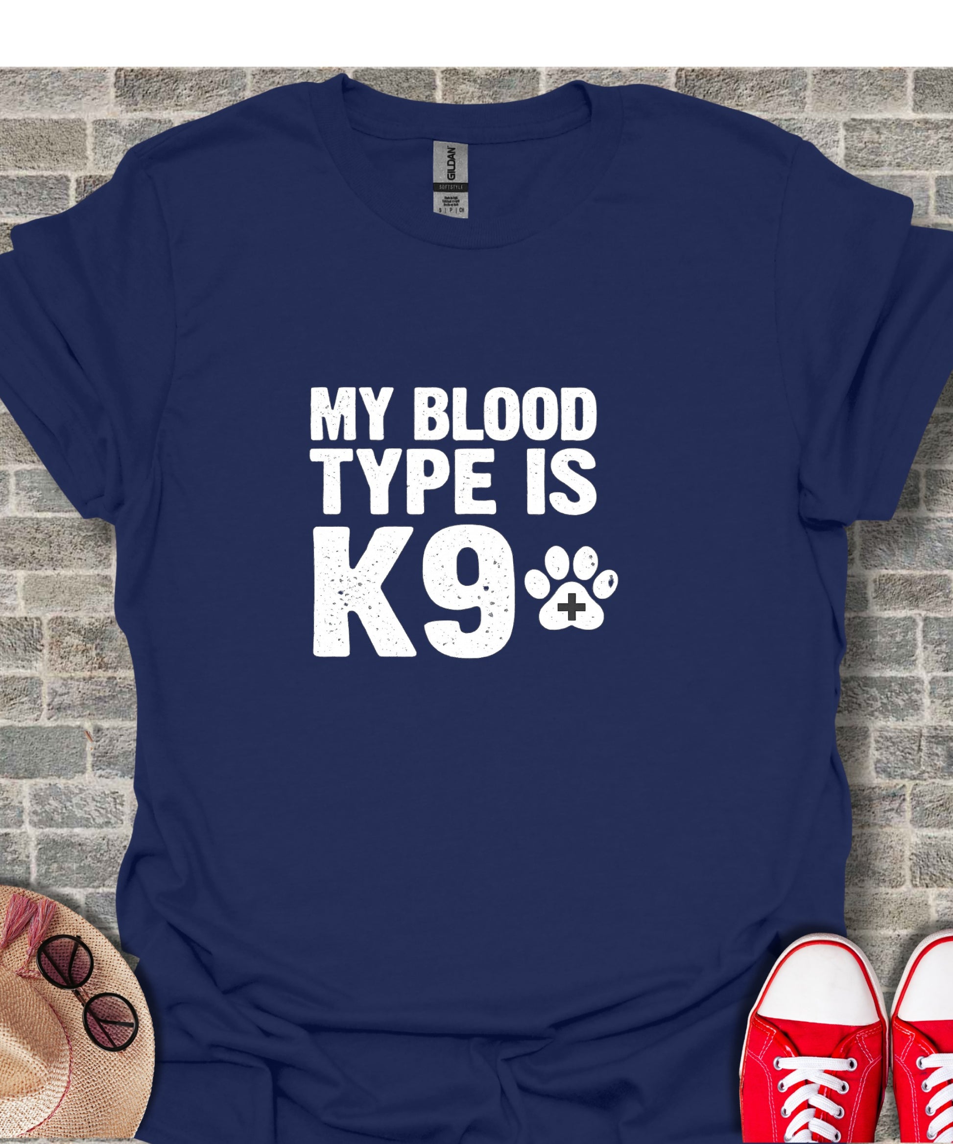 Navy t-shirt with white text "MY BLOOD TYPE IS K9" and paw print.