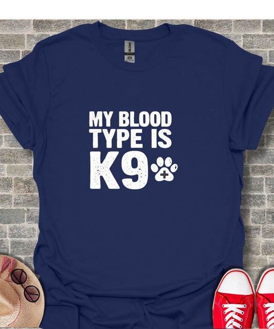 Navy t-shirt with white text "MY BLOOD TYPE IS K9" and paw print.