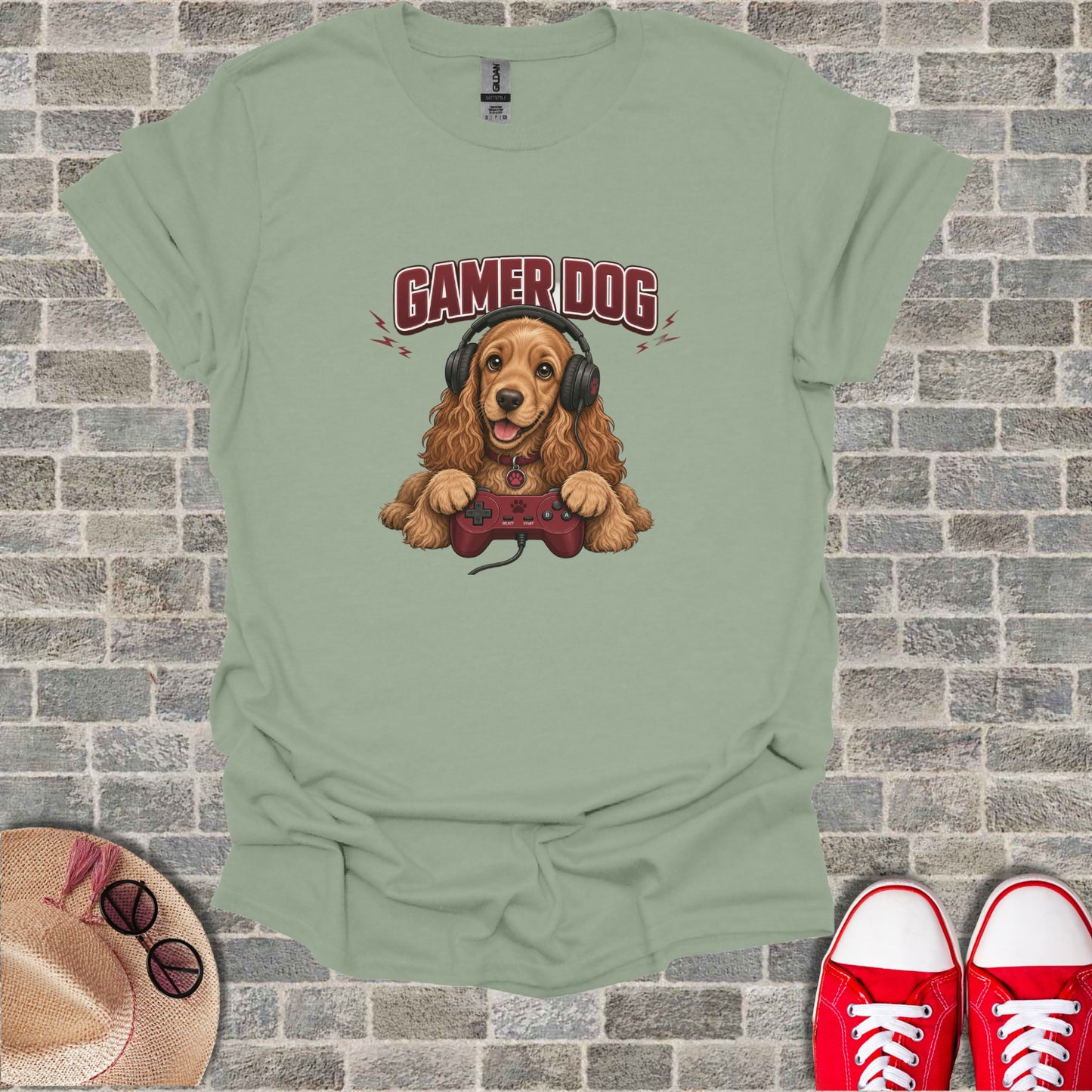 Brown dog wearing headphones, holding a video game controller, text reads "Gamer Dog".