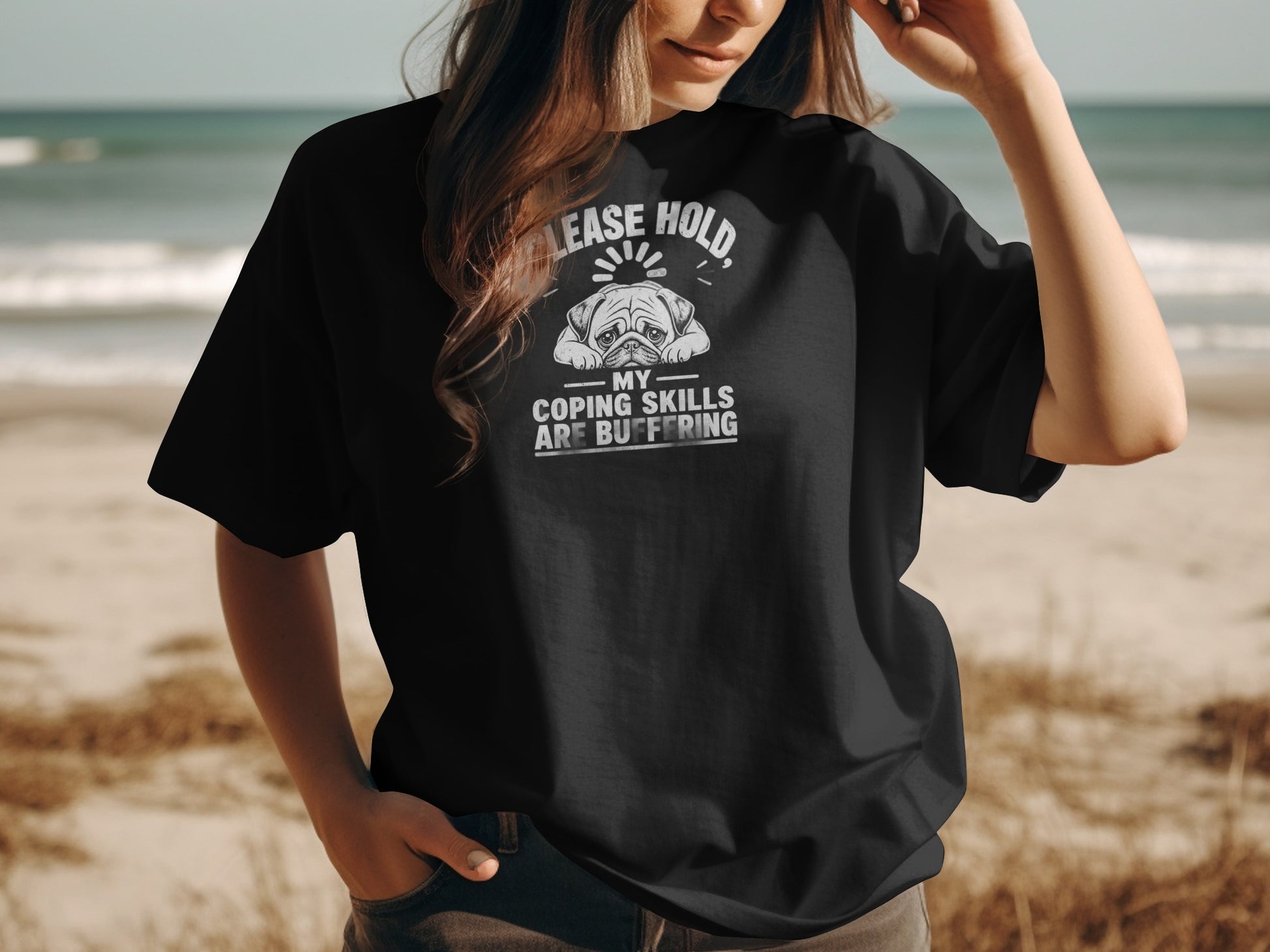 Black t-shirt with a pug graphic and text "PLEASE HOLD MY COPING SKILLS ARE BUFFERING".