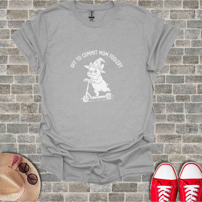Gray t-shirt with white graphic of pug on scooter wearing witch hat.