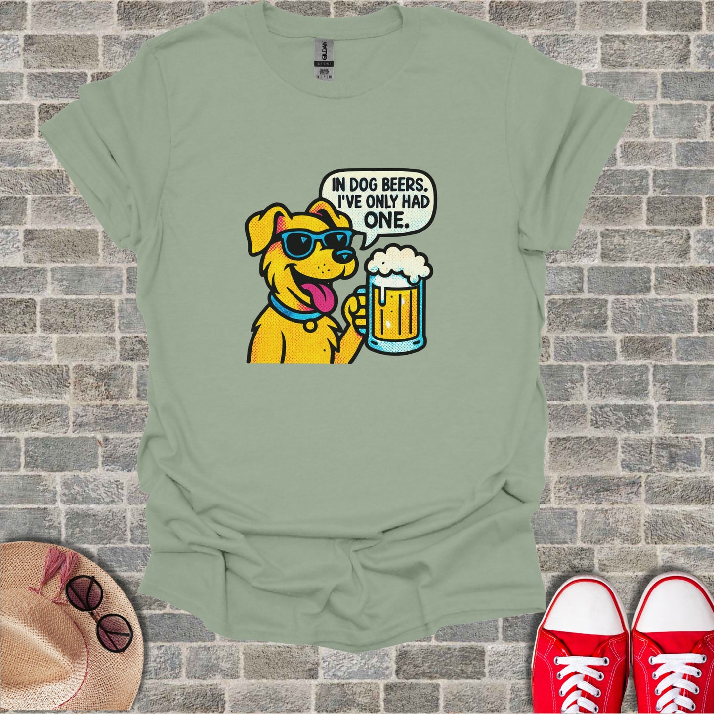 Yellow dog in sunglasses holding a beer, text says "In dog beers, I've only had one."