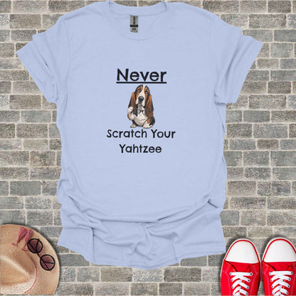 Light blue t-shirt with a Basset Hound and "Never Scratch Your Yahtzee" text.
