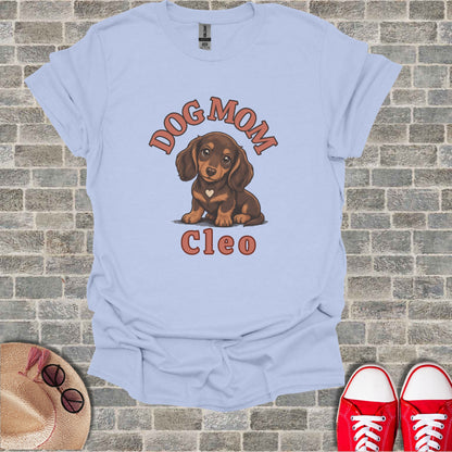 Light blue t-shirt with brown dachshund graphic and text "DOG MOM Cleo."