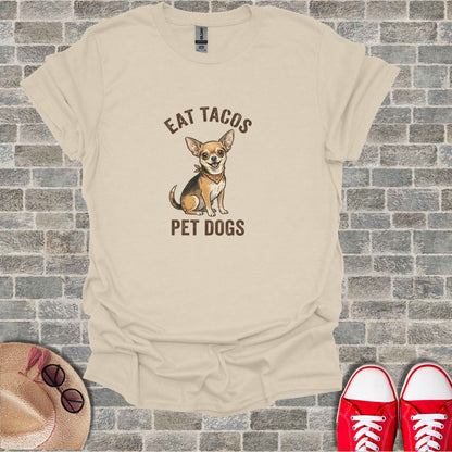 Cream t-shirt with cartoon chihuahua and text "EAT TACOS PET DOGS".