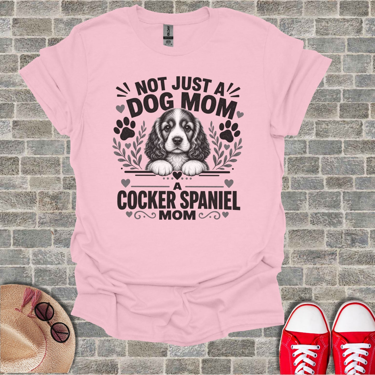 Pink t-shirt with "Not Just A Dog Mom, A Cocker Spaniel Mom" graphic and dog illustration.